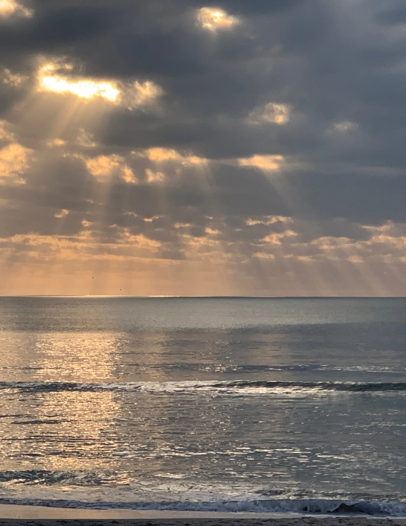 A serene ocean sunset photographed by Mindy Waite.